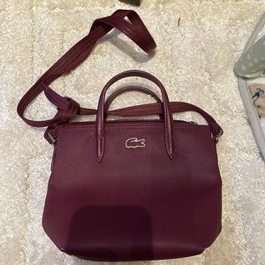 Small burgundy Lacoste cross body bag